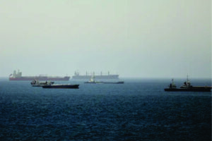 Oil prices ease after spiking over halt to Strait of Hormuz evacuation plan.